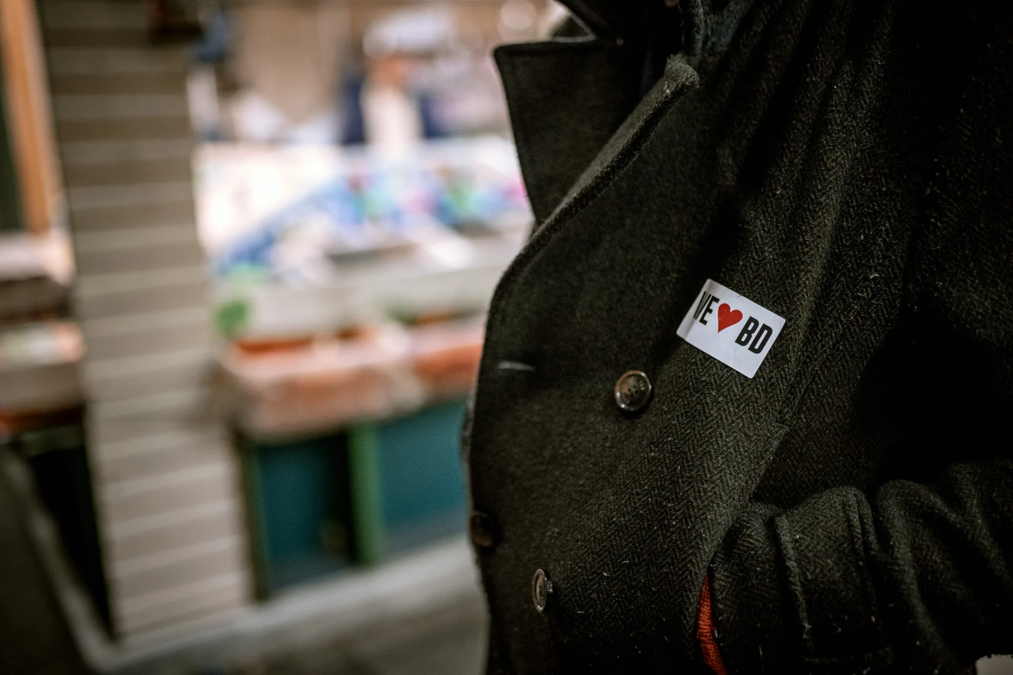 A coat with a sticker reading 'I heart BD'