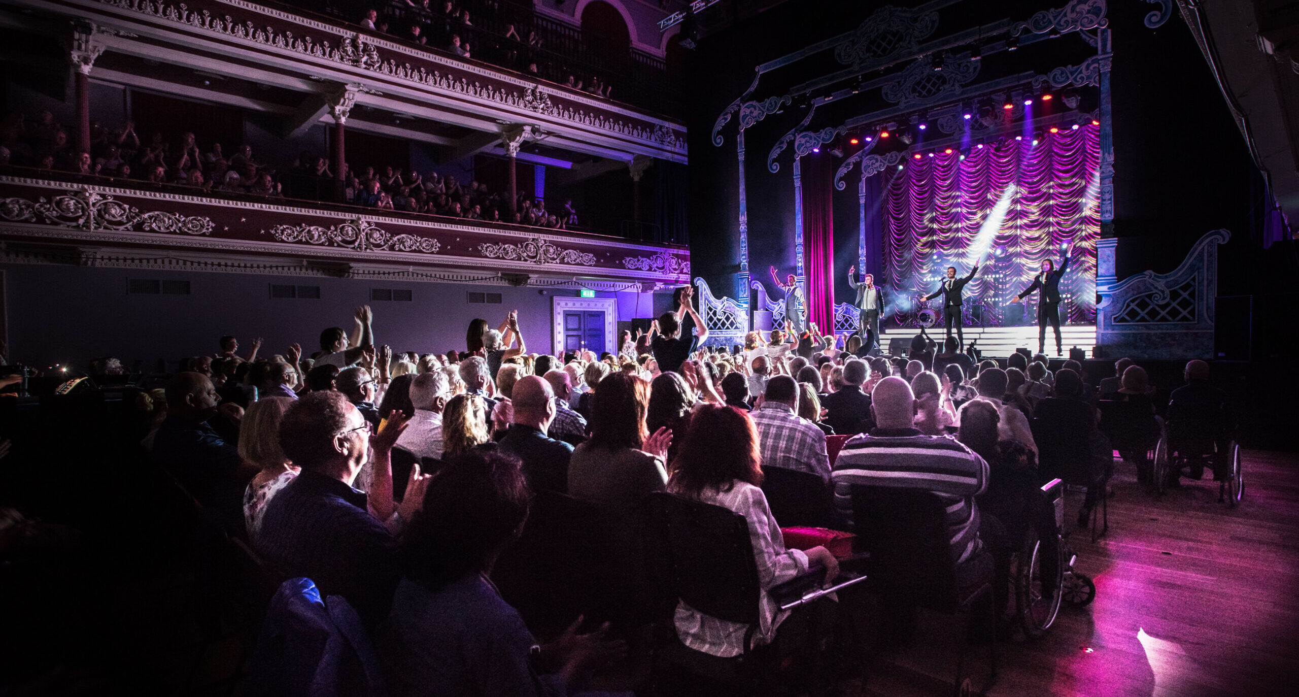 Performance on stage at St George's Hall, Bradford