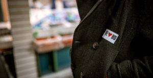Close of up of a wool jacket with a sticker that says I heart Bradford