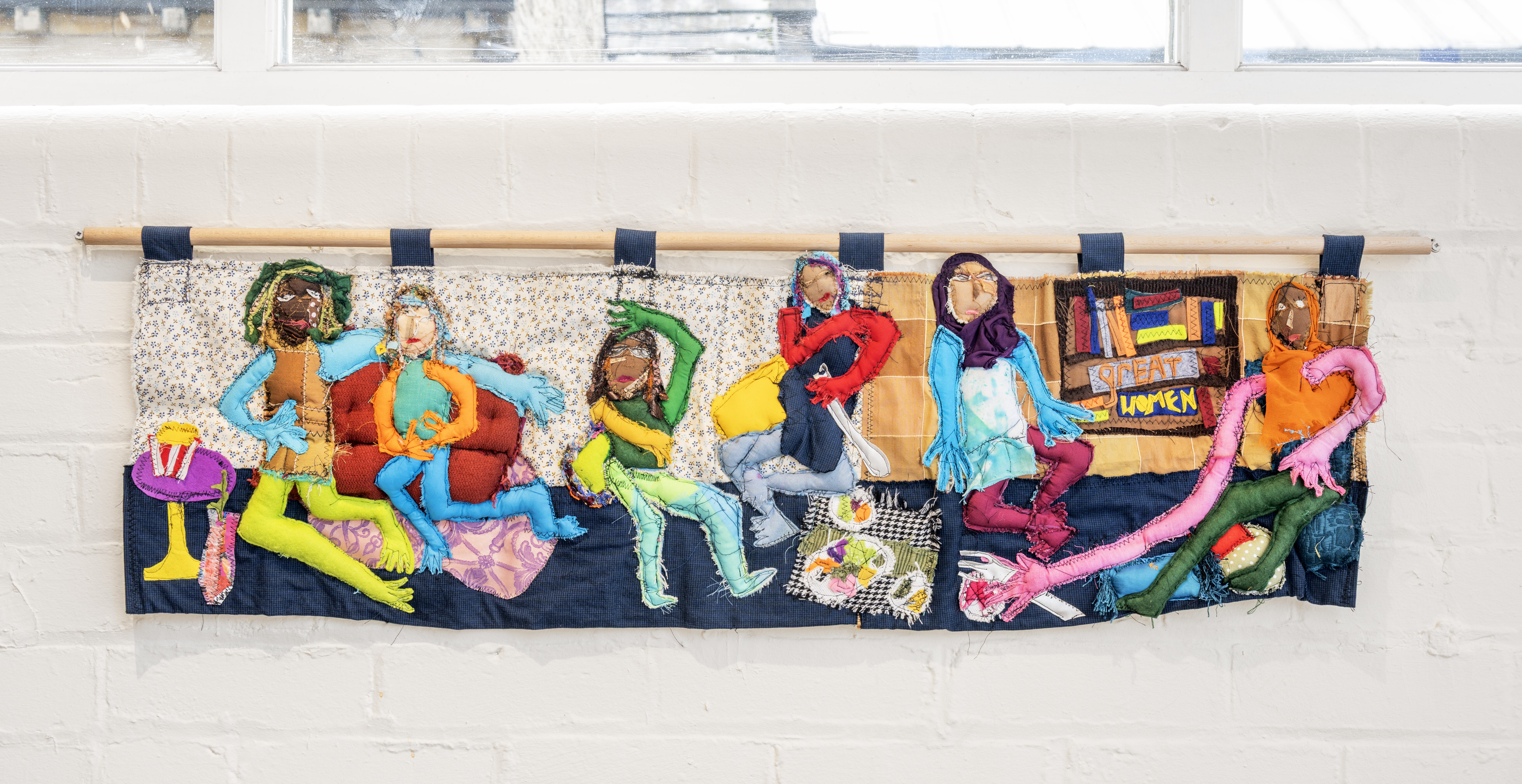 Textile tapestry depicting women by artist Atiyya Mirza